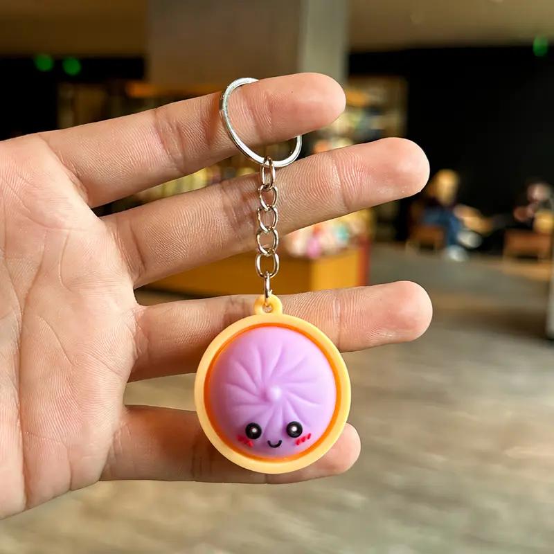 Light-Up Cute Dumpling Pressable Fidget Keychain - PVC Food‑Shaped Charm, Wear‑Resistant Stress Relief Toy for Daily Use, Party & Gifting