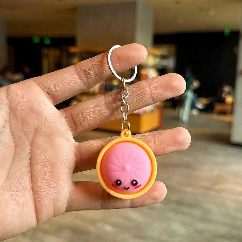 Light-Up Cute Dumpling Pressable Fidget Keychain - PVC Food‑Shaped Charm, Wear‑Resistant Stress Relief Toy for Daily Use, Party & Gifting